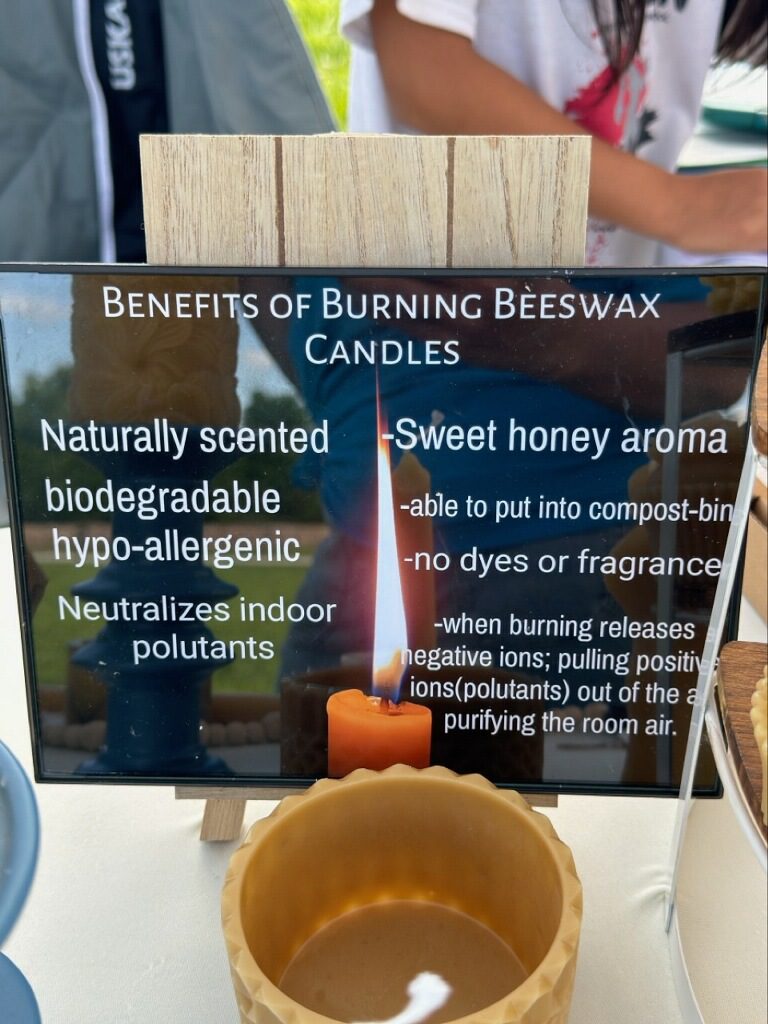Beeswax candle benefits sign on display