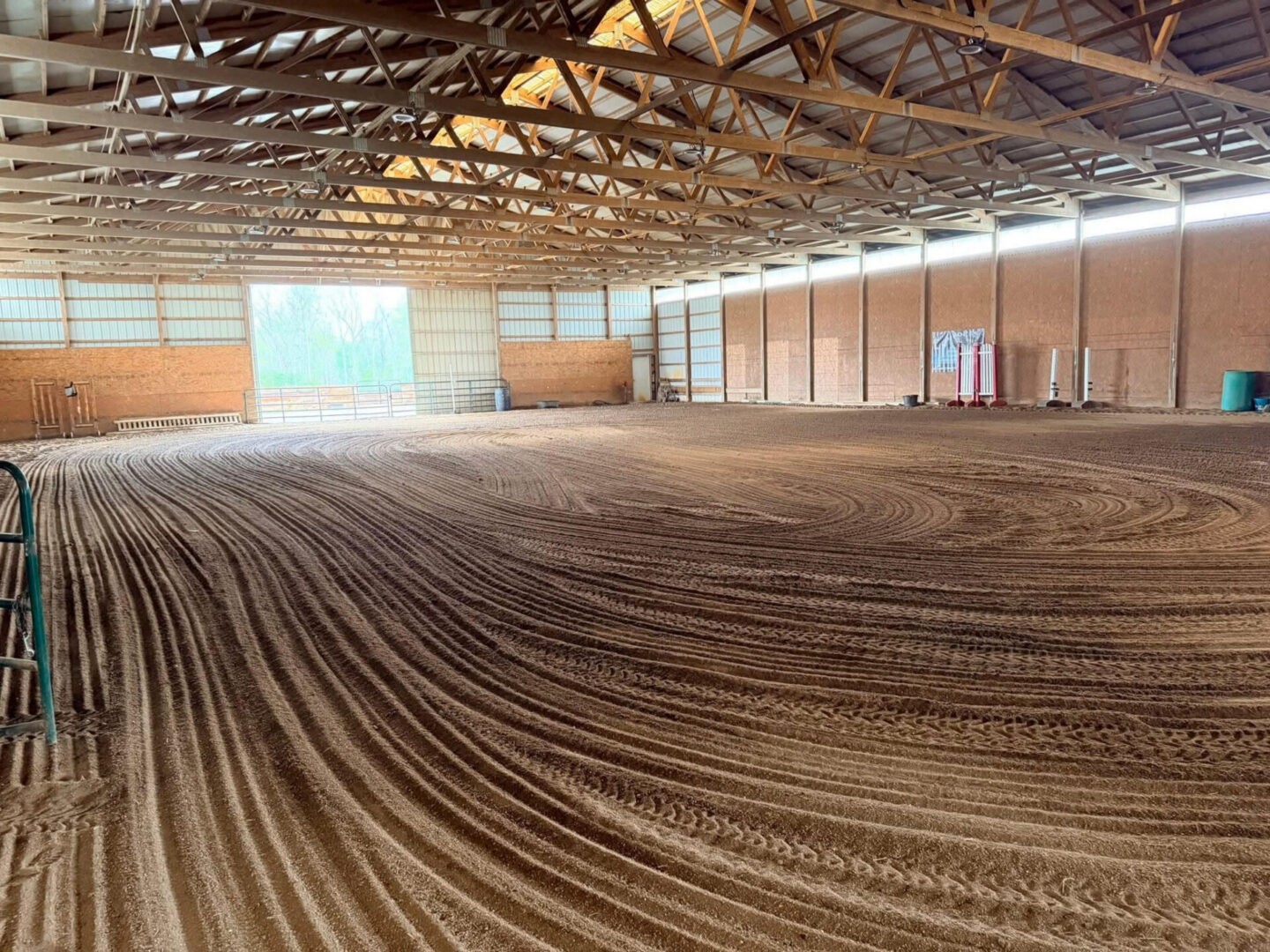 Indoor horse arena with groomed dirt floor